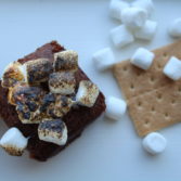 s'more brownies with a graham cracker and marshmallows